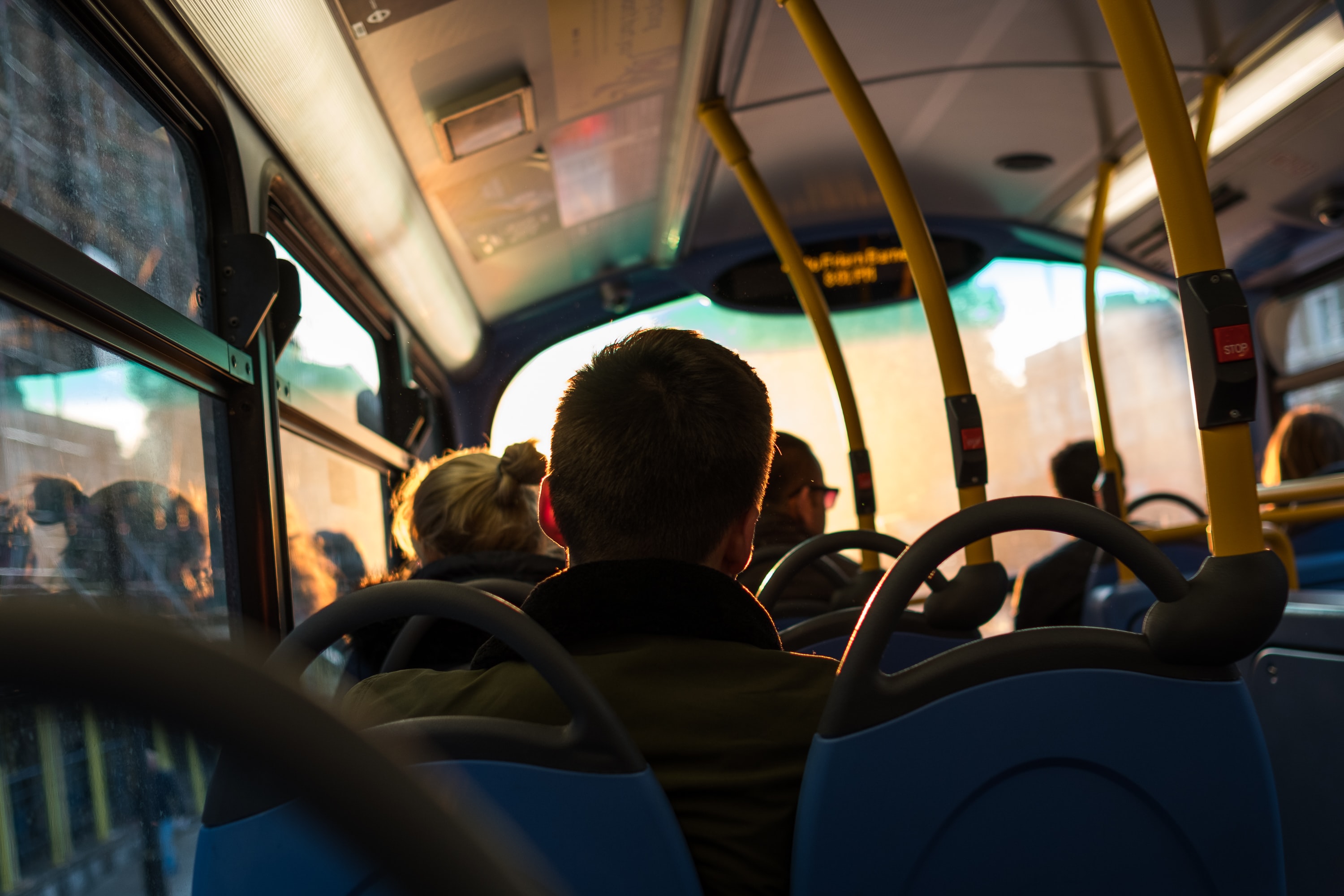 Picture of a young man sitting on a bus
